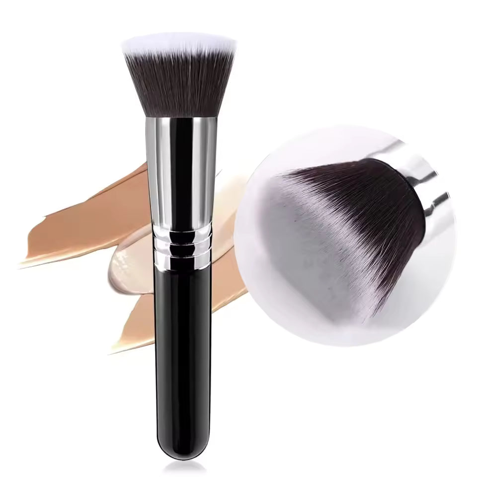 Makeup brush with black handle and white bristles on a white background